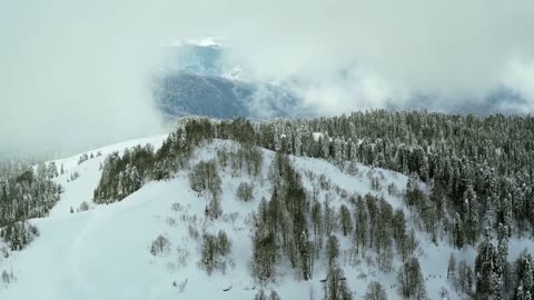 Aerial Footage of Mountains Covered with Snow. Amazing Beautiful Nature Scenery with Relaxing Music