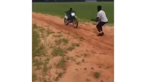 instant regret-dude tries jumping another guy on motorbike