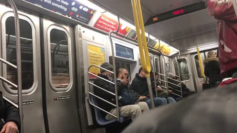 Man in red leather jacket spinning listening to music