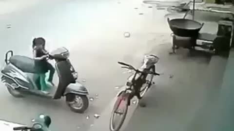 Little girl tries to ride the bike.see what happend next