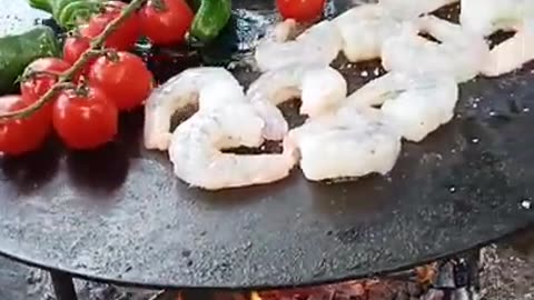 Delicious vegetables and shrimps on the campfire. Do you also like to cook outside?