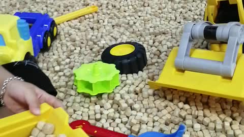 Smart toddler playing with material excavator at supermarket - part 2