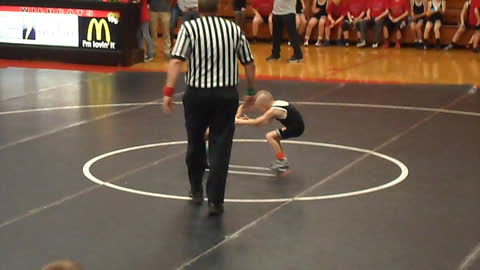 Little Brother Tries To Help Sibling Win His Wrestling Match