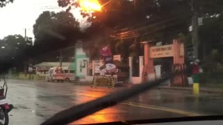 Sparks Fly as Strong Winds Blow Power Line Into Trees