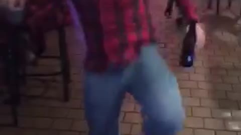 Red plaid shirt dancing slips and falls down