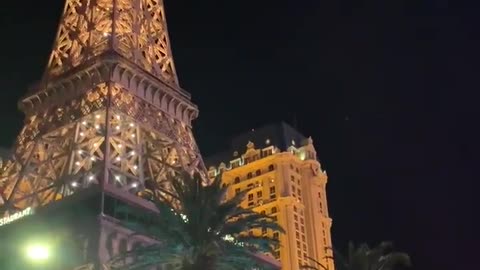 View of the Eiffel Tower in Paris, with street traffic