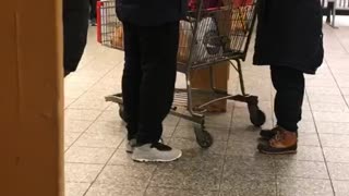 Woman with shopping cart on subway platform