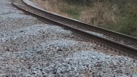 Steam locomotive leaving town