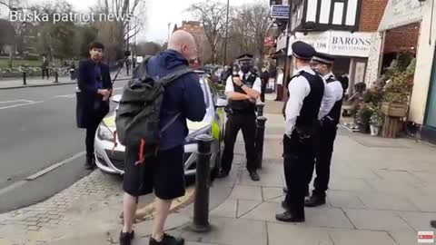 police moving on piers corybn and supporters leafleting out side TURNHAM GREEN STATION