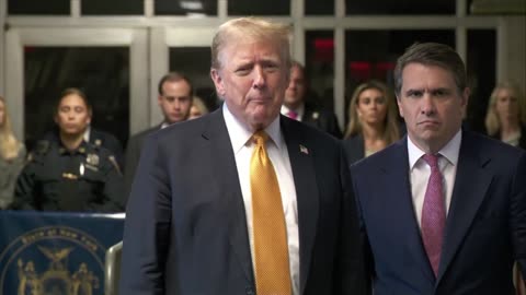 Donald Trump speaks to media in hallway of New York courthouse