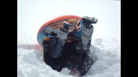 Woman On Inner Tube Takes Hard Flip At Bottom Of Hill