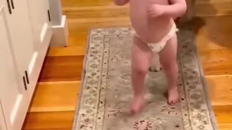 Cute baby playing with dog