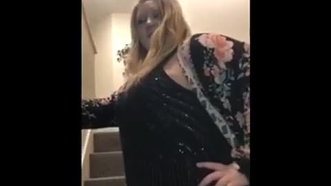 Girl black dress dancing on top of stairs