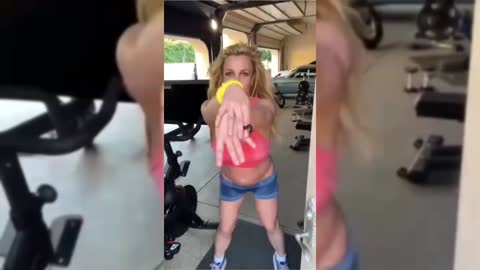 Britney Spears Revives Her Y2K Denim Shorts With Versatile Sneakers for Dance Routine.