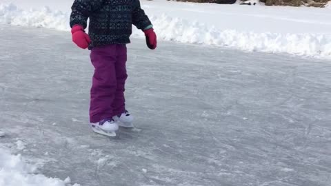 Girl Learning To Ice Skate Says It's Easy While Dad Falls Behind Her