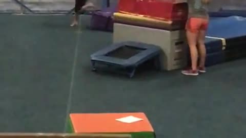 Pink gymanstics trampoline faceplant