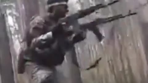 Chechen soldier fires double AKs!