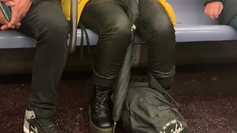 Girl eats french fry chips with chopstick on subway train