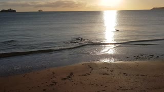 Sunlight tracing over calm water