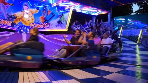 People Enjoying A Ride At The Carnival