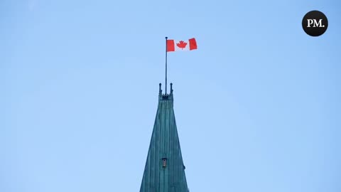 The Canadian flag flies high on the Peace Tower in Ottawa as the bells play O Canada.