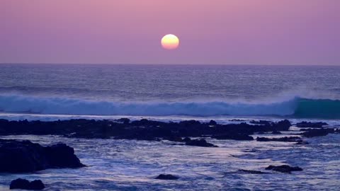 Ocean waves with sunset