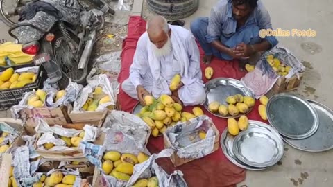 Heard working Old man Making And Selling Mango Juice Ice Mango Milkshake Summer Energy Street Drink