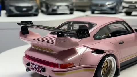 Sexy pink Porsche with champagne gold wheels. It's so cool!