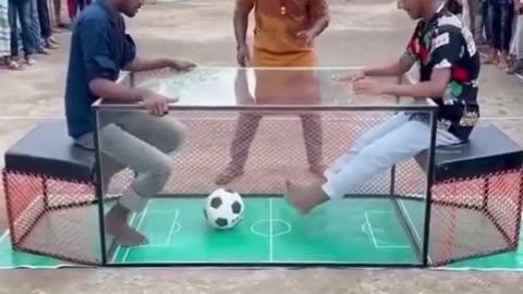 FOOTBALL MATCH IN A GLASS TABLE