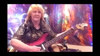 Female lead guitarist playing the blues- Cari Dell