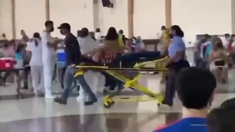 CAUGHT ON FILM: LADY WHEELED OUT OF THE COVID-19 VACCINATION CLINIC ON A STRETCHER