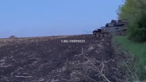 A Ukrainian tank hits an abandoned Russian T-72.