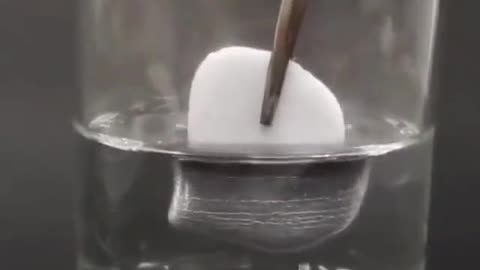 Solid Mercury in warm water