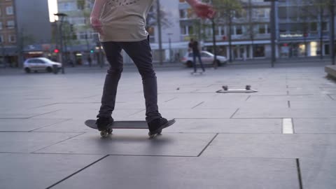 Skateboarder Does Trick on Skateboard