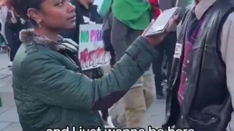 A British young woman says she is with “Queers for Palestine”