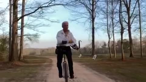 Guy Displays Archery Skills While Riding Unicycle