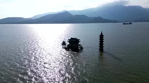 Drone footage shows Chinese temple partially submerged