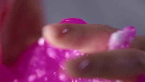 A Hand Squeezing the Slime