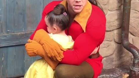 Little Girl Hugs Gaston At A Disney Park And Won't Let Go