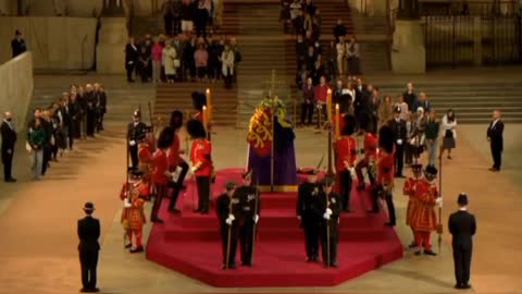 Royal guard at the Queen's coffin has collapsed.