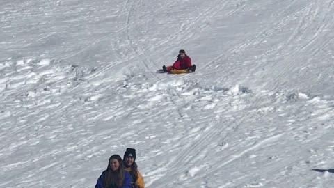 Sledder Collides With Barrier