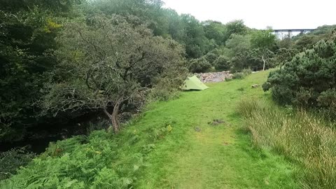 Drone footage. Wildcamping next to a river.