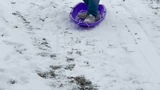 Man's Sledding Stunt Ends in a Snowy Roll