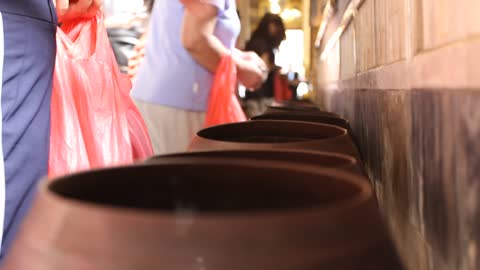 People depositing coins