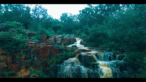 top notch Drone view of marble rock waterfall