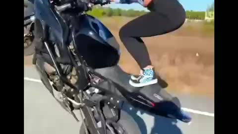 Girl bike stunt