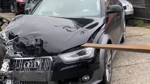 The bonnet of the car is stuck. Try using a forklift