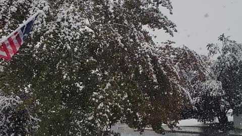 Balloon floating while snowing