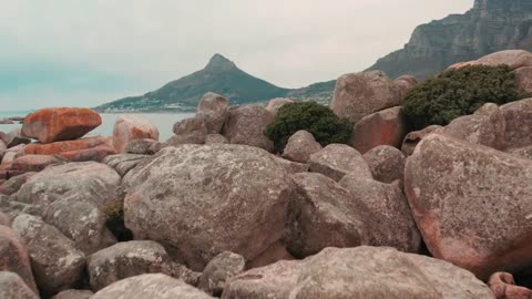 oulders of Rock Lying Along The Coastline of the Sea In Capetown , South Africa | Tro Videos