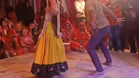 funny cock dance of indian couple at wedding